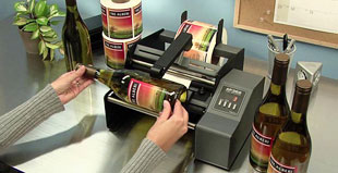 applicatore semi-automatico di etichette in rotolo, sistema professionale da tavolo per bottiglie, scatole, flaconi, vasetti in vetro, ecc.